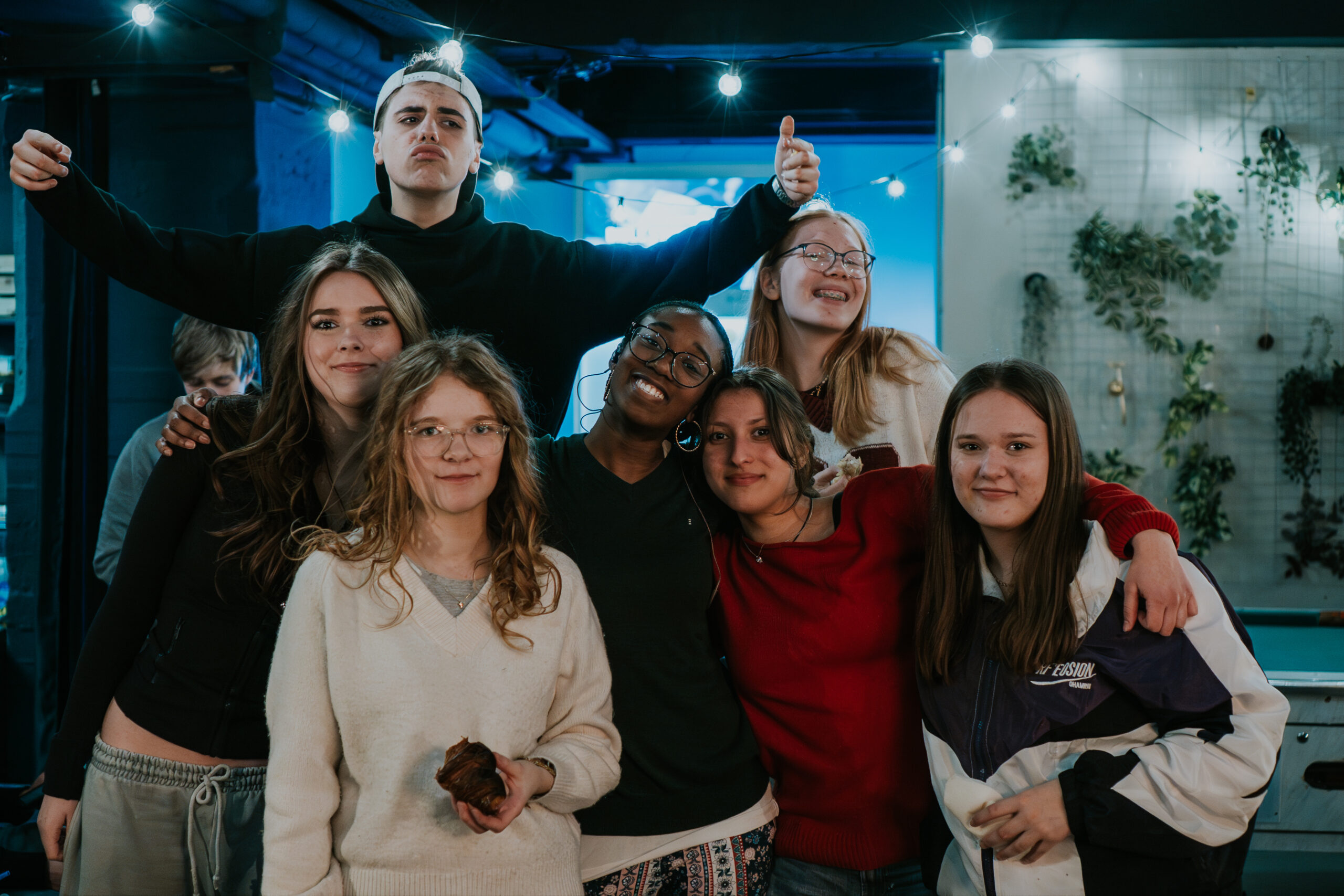 A group of young people at ICF Berlin who celebrate community and faith in a modern church.
